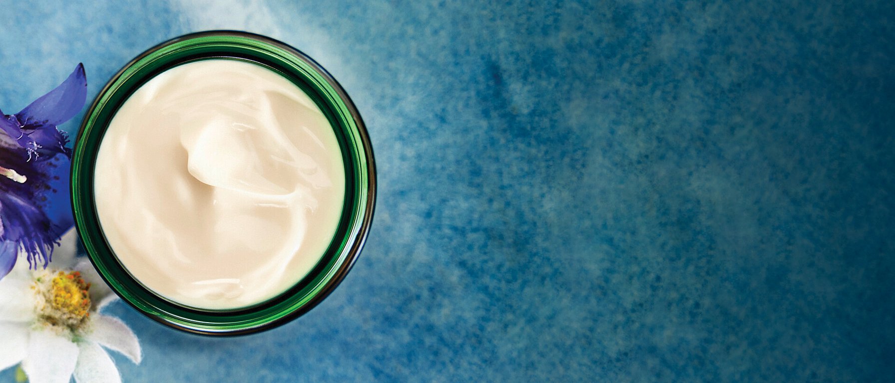 open jar of rejuvenating day cream