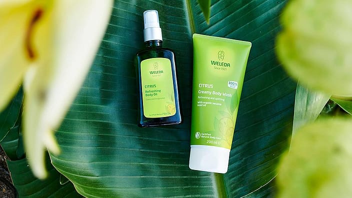 weleda items flat lay on a leaf