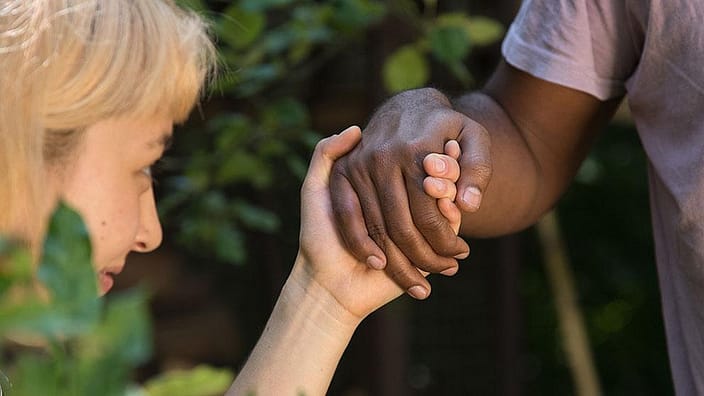 two people holding hands