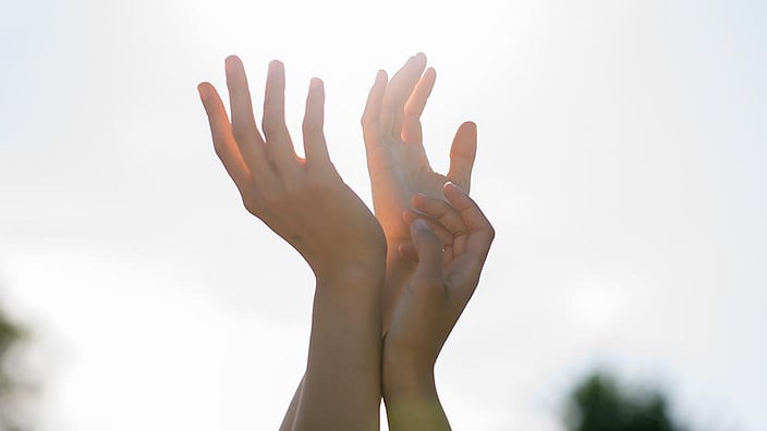 Hands in sunlight