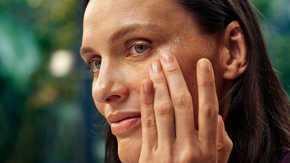 woman applying plumping eye cream